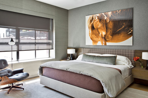 409559-With_a_Charles_and_Ray_Eames_chair_nearby_the_master_suite_s_custom_bed_frame_and_headboard_are_covered_in_wool_